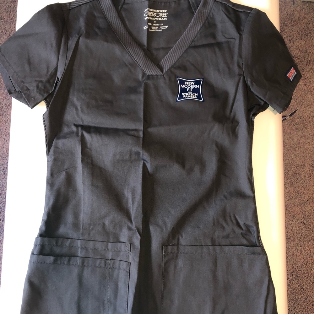 Cherokee scrub top with pockets.